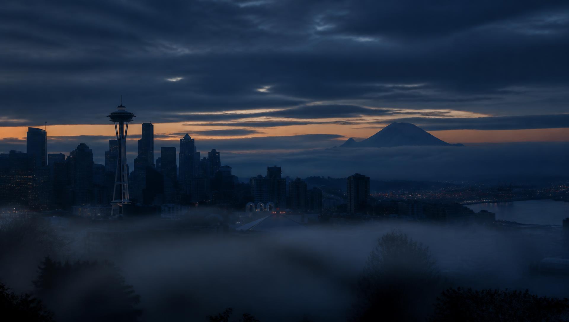 Seattle skyline at dusk with Mount Rainier in the distance